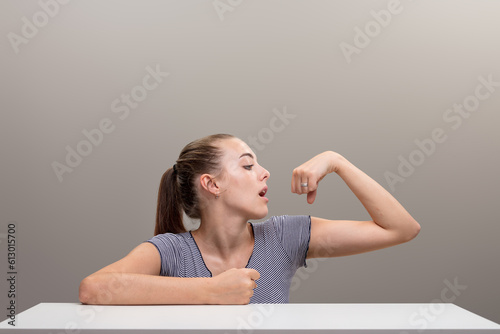 Polishes ring, flexes muscle, shows power