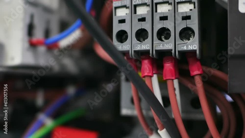 Close up of Wires and electrical circuits in control boxes for industrial machinery, Safety and energy industry technology concepts.