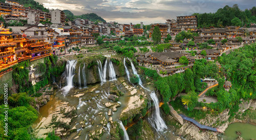 Fototapeta Naklejka Na Ścianę i Meble -  Beautiful ancient town in China with waterfall and traditional houses