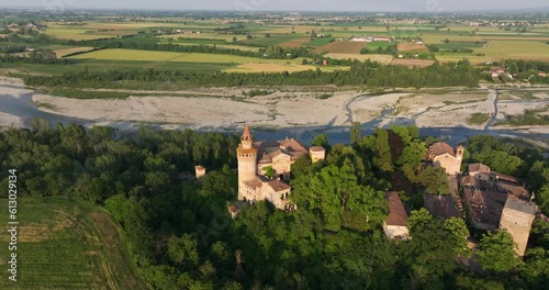 Aerial approach of Rivalta Castle in Piacenza province, Italy. Drone descending view photo