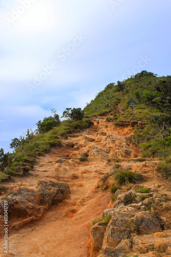 Hiking Trail, grassy plains and hills, in Horton Plains National Park, Central highlands of Sri Lanka.