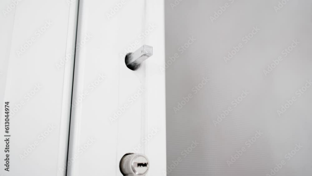 The packaging factory protective film is torn off from a white plastic door close-up The packaging factory protective film is torn off from a white plastic door close-up