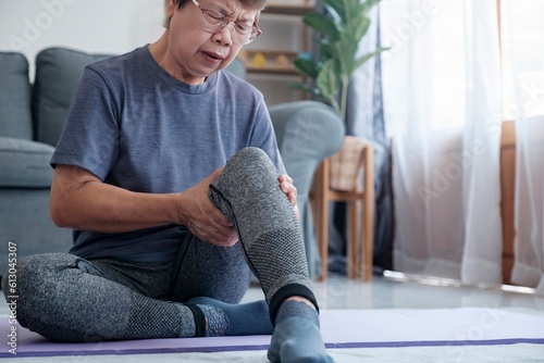 Mature female athlete with joint or muscle soreness and problem