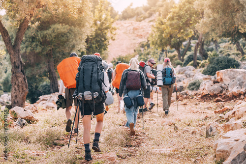 Group of hikers walking by the Lycian Way footpath in turkish countryside photo