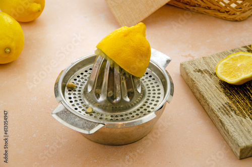 Half lemon on a hand juicer