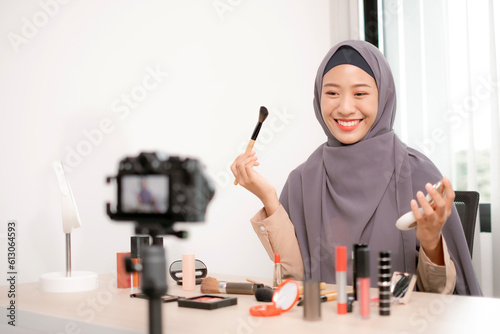 Beauty blogger live-streaming makeup application and carefully selecting professional cosmetics, providing expert advice for achieving flawless looks.