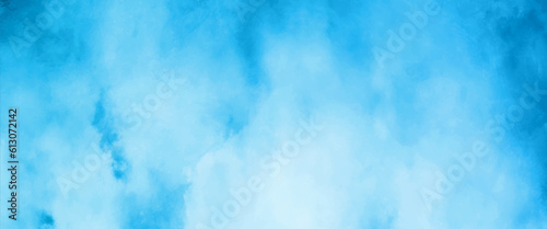 Beautiful and shinny cloudy blue watercolor background, sky blue shades light green paper texture blue gradient ink colors wet effect hand drawn canvas background wallpaper.	