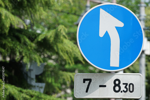 Wallpaper Mural Blue traffic sign showing left turn on Japan Torontodigital.ca