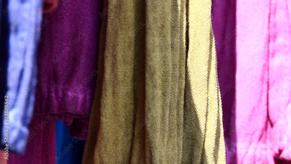 close-up tassels of a woman's dress. The clothes hanging in the store are swaying with the wind. 4k video fashion theme
close-up tassels of a woman's dress. The clothes hanging in the store are swaying with the wind. 4k video fashion theme