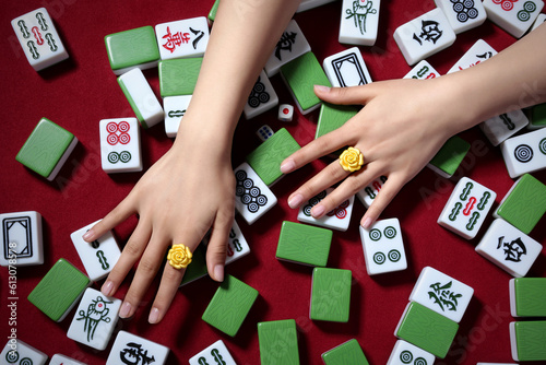 Female hands and Mahjong(majiang), close-up, Chinese board game