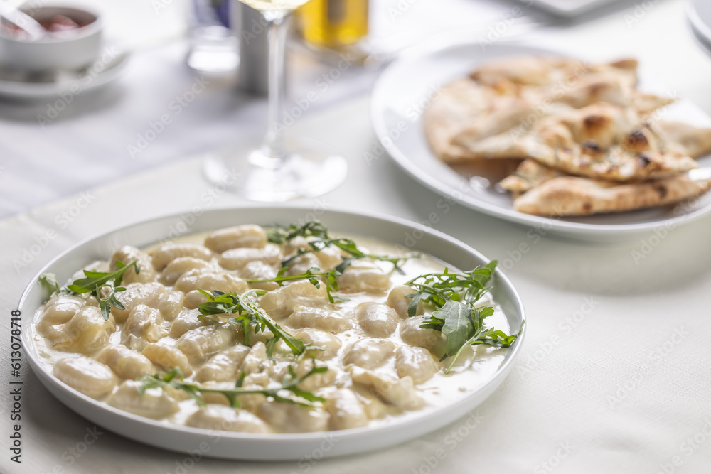 Gnocchi with cheese, hearty food from northern Italy, served with ruccola