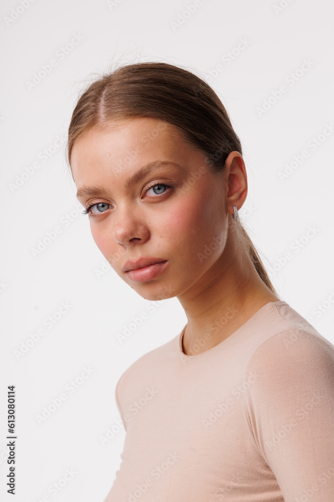 Beautiful young girl with fresh healthy skin. Woman advertise ear-rings. White background. Earrings closeup. Blond european woman with long hair with big lips, pretty smile. Cosmetology, scincare Beautiful young girl with fresh healthy skin. Woman advertise ear-rings. White background. Earrings closeup. Blond european woman with long hair with big lips, pretty smile. Cosmetology, scincare