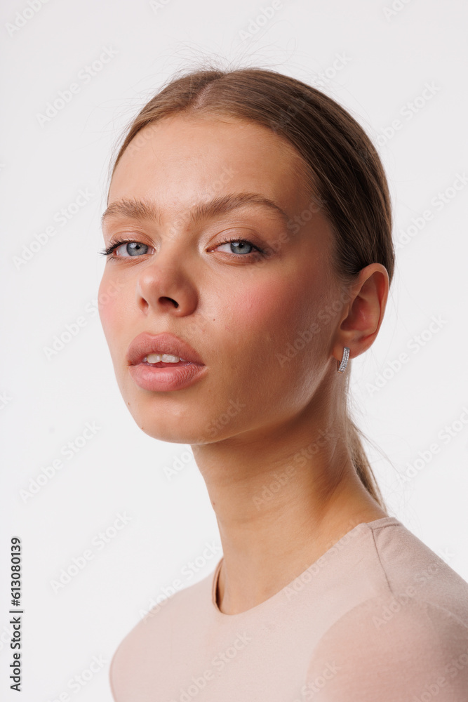 Beautiful young girl with fresh healthy skin. Woman advertise ear-rings. White background. Earrings closeup. Blond european woman with long hair with big lips, pretty smile. Cosmetology, scincare Beautiful young girl with fresh healthy skin. Woman advertise ear-rings. White background. Earrings closeup. Blond european woman with long hair with big lips, pretty smile. Cosmetology, scincare