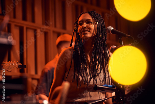 Beautiful Afro-Carribbean Girl looking pensive during live show