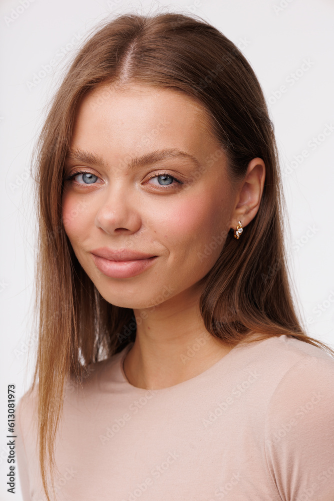Beautiful young girl with fresh healthy skin. Woman advertise ear-rings. White background. Earrings closeup. Blond european woman with long hair with big lips, pretty smile. Cosmetology, scincare Beautiful young girl with fresh healthy skin. Woman advertise ear-rings. White background. Earrings closeup. Blond european woman with long hair with big lips, pretty smile. Cosmetology, scincare