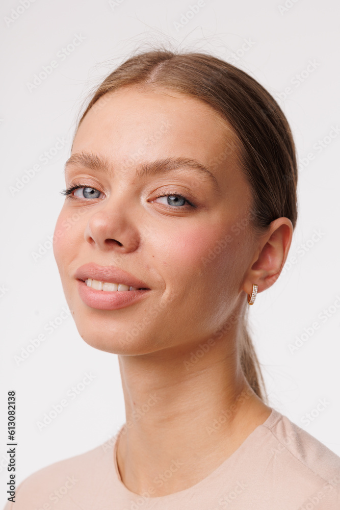Beautiful young girl with fresh healthy skin. Woman advertise ear-rings. White background. Earrings closeup. Blond european woman with long hair with big lips, pretty smile. Cosmetology, scincare Beautiful young girl with fresh healthy skin. Woman advertise ear-rings. White background. Earrings closeup. Blond european woman with long hair with big lips, pretty smile. Cosmetology, scincare