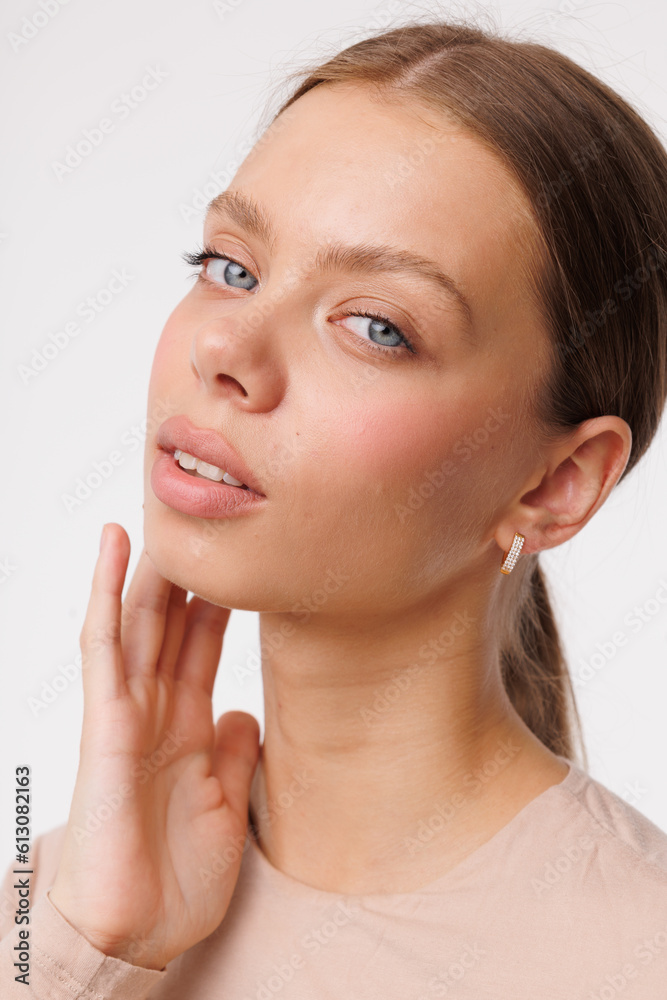 Beautiful young girl with fresh healthy skin. Woman advertise ear-rings. White background. Earrings closeup. Blond european woman with long hair with big lips, pretty smile. Cosmetology, scincare Beautiful young girl with fresh healthy skin. Woman advertise ear-rings. White background. Earrings closeup. Blond european woman with long hair with big lips, pretty smile. Cosmetology, scincare