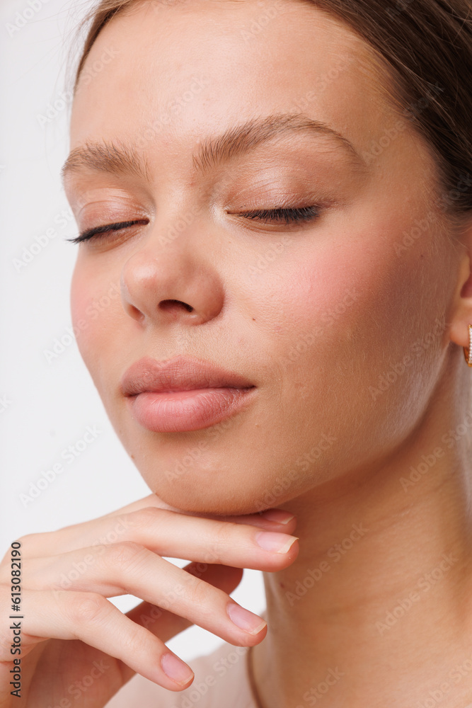 Beautiful young girl with fresh healthy skin. Woman advertise ear-rings. White background. Earrings closeup. Blond european woman with long hair with big lips, pretty smile. Cosmetology, scincare Beautiful young girl with fresh healthy skin. Woman advertise ear-rings. White background. Earrings closeup. Blond european woman with long hair with big lips, pretty smile. Cosmetology, scincare