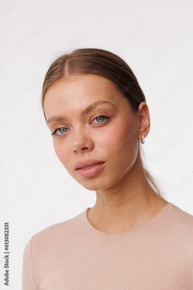 Beautiful young girl with fresh healthy skin. Woman advertise ear-rings. White background. Earrings closeup. Blond european woman with long hair with big lips, pretty smile. Cosmetology, scincare Beautiful young girl with fresh healthy skin. Woman advertise ear-rings. White background. Earrings closeup. Blond european woman with long hair with big lips, pretty smile. Cosmetology, scincare
