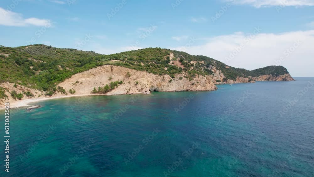 Circular Aerial View, Isolated And Empty Beach With White Sand, Turquoise Water, Lush Vegetation And Birds Flying Around, Fari Beach, Thassos Island, Greece Circular Aerial View, Isolated And Empty Beach With White Sand, Turquoise Water, Lush Vegetation And Birds Flying Around, Fari Beach, Thassos Island, Greece