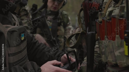 Ukrainian military coordinating a drone during battle