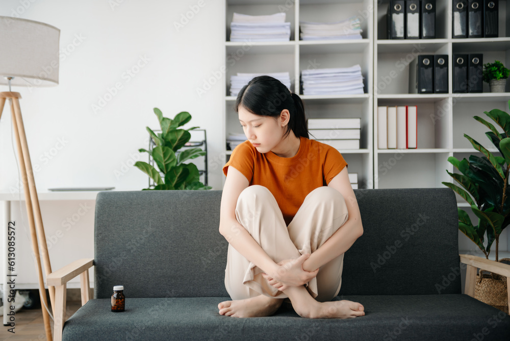 Fototapeta premium Asian woman sit Depression Dark haired pensive glance Standing by window and anxiety Copy space.