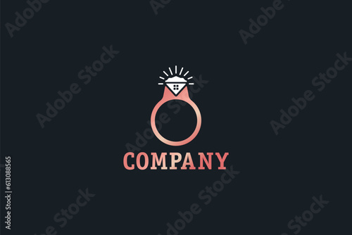 Logo design of a ring with a diamond shaped like a house. 