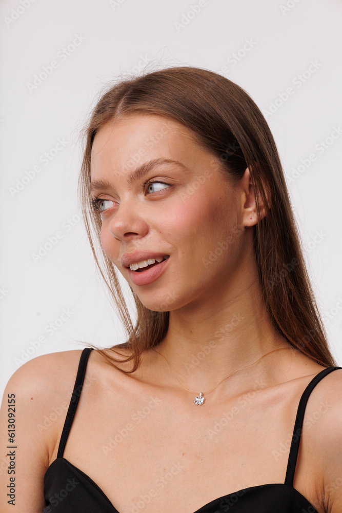 Beautiful young girl with fresh healthy skin. Woman advertise ear-rings. White background. Earrings closeup. Blond european woman with long hair with big lips, pretty smile. Cosmetology, scincare Beautiful young girl with fresh healthy skin. Woman advertise ear-rings. White background. Earrings closeup. Blond european woman with long hair with big lips, pretty smile. Cosmetology, scincare