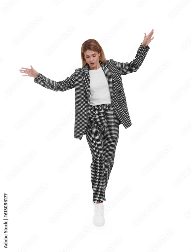 Beautiful businesswoman in suit walking on white background Beautiful businesswoman in suit walking on white background