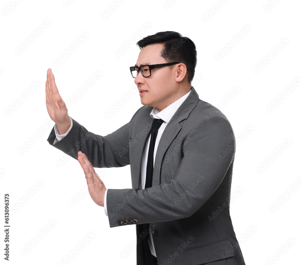 Scared businessman in suit posing on white background Scared businessman in suit posing on white background