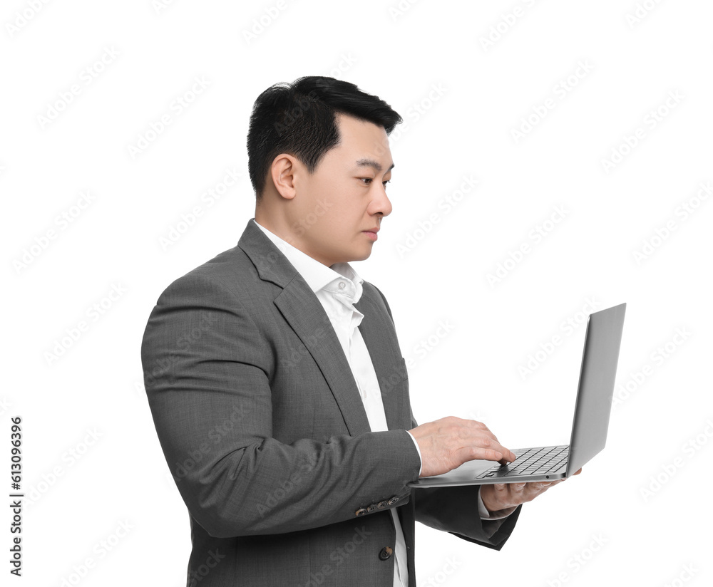 Businessman in suit working on laptop against white background Businessman in suit working on laptop against white background