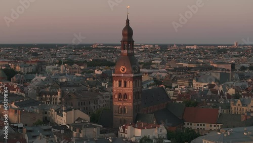 Beautiful sunset over Riga old town in Latvia. Aerial view of the Domes cathedral and old town of Riga. Warm sunset colors.