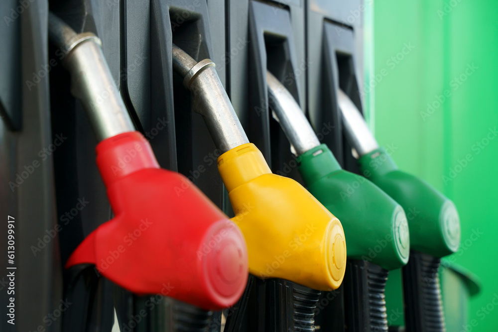 Petrol station. Pistols with gasoline and diesel fuel at a car gas station. Oil business and transportation costs Petrol station. Pistols with gasoline and diesel fuel at a car gas station. Oil business and transportation costs
