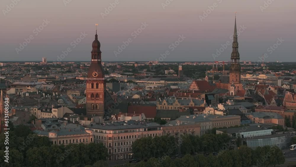 Beautiful sunset over Riga old town in Latvia. Aerial view of the Domes cathedral and old town of Riga. Warm sunset colors. Beautiful sunset over Riga old town in Latvia. Aerial view of the Domes cathedral and old town of Riga. Warm sunset colors.