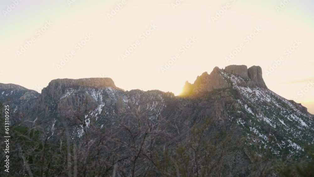 Casa Grande Peak with Sun Setting in Background in Big Bend National Park in Texas, USA. Sunrise on the mountain range overlooking from Lost Mine Trail Hinking