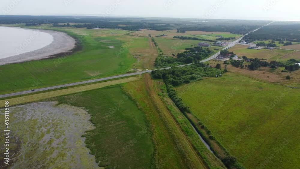 Drone shot road cutting through beautiful wild nature in Denmark Drone shot road cutting through beautiful wild nature in Denmark