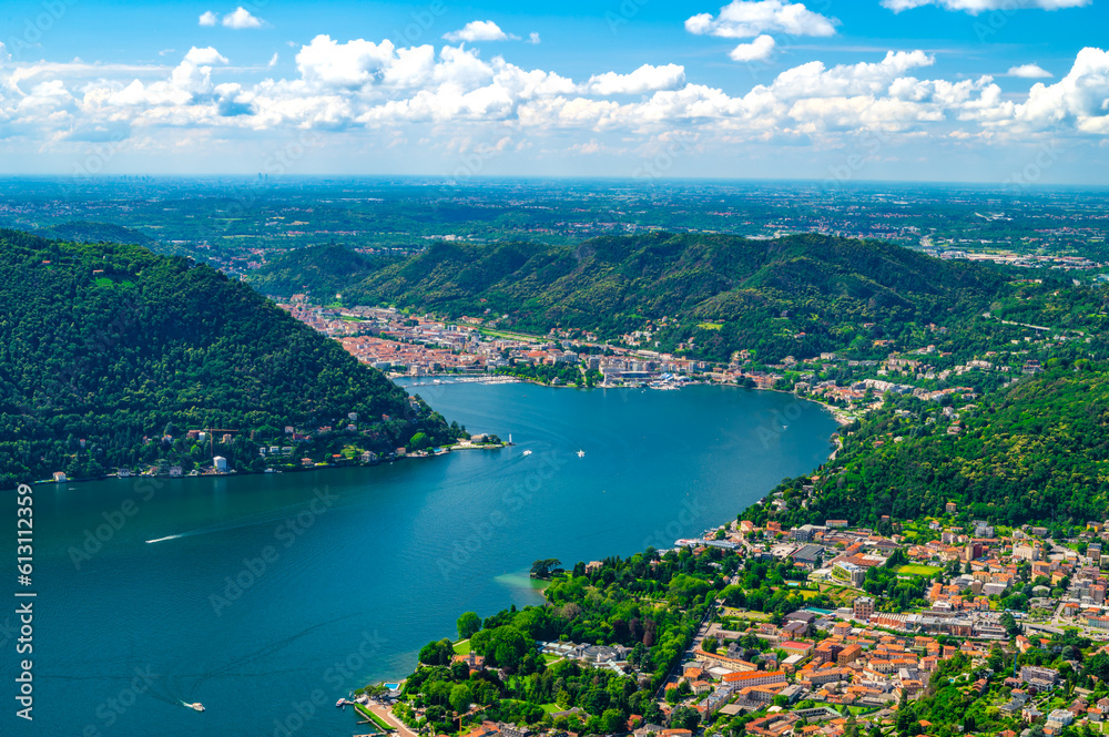 Panorama of Lake Como and the city of Como, the port and the mountains, from Cernobbio, on a summer day.
