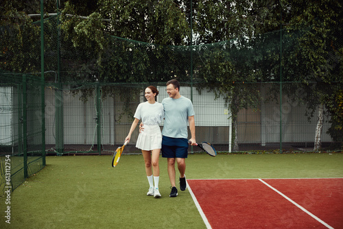 Young couple on court for training, smile and happy together outdoor for wellness, health or fitness. Sport, healthy man and woman practice, workout or exercise for game.