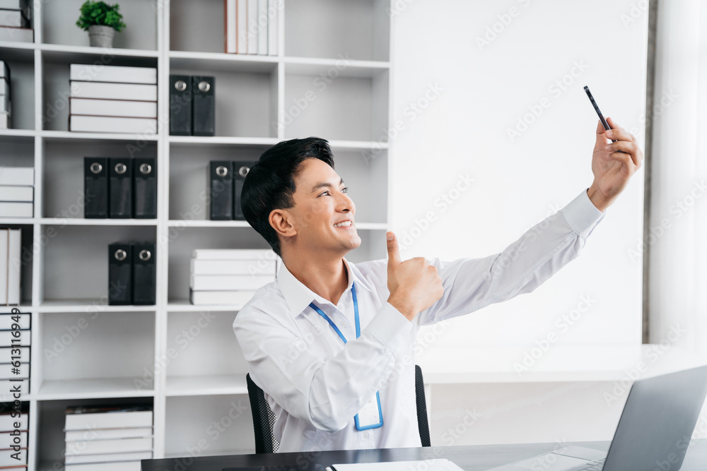 Happy businessman holding phone looking at screen waving hands video call friend online in mobile chat app using smartphone video chat application. Happy businessman holding phone looking at screen waving hands video call friend online in mobile chat app using smartphone video chat application.
