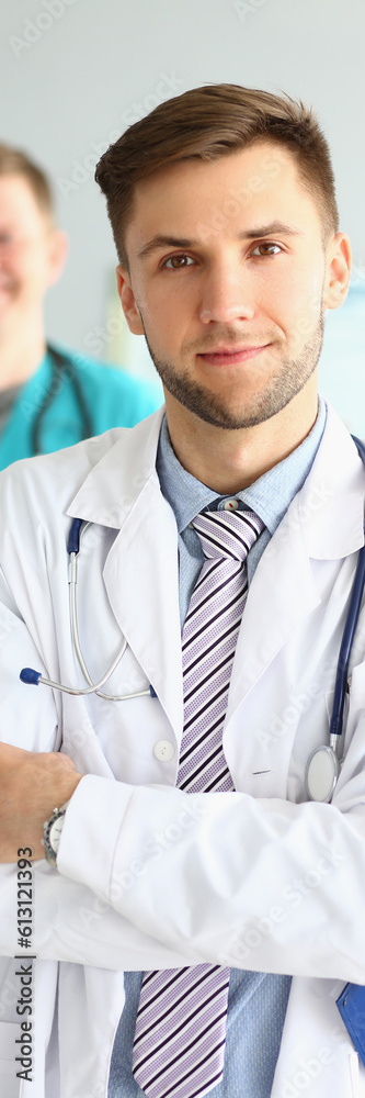 Obraz premium Medical team of doctors men looking at camera and smiling. Medical professional service and insurance concept
