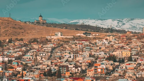 Tbilisi, Georgia. Elevated top Scenic View hillside Church of the Nativity of the Virgin. vazisubani settlement district. Georgian Capital Skyline Cityscape Time lapse timelapse. Tbilisi, Georgia. photo