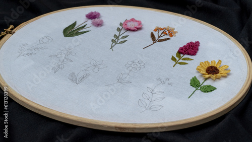 Floral Serenity: Hand Embroidery Flowers on White Fabric with Wooden Hoop