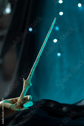 Φωτογραφία Magic wand artifact in wooden hand