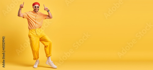 Funky guy dance summer vacation active person wear shirt pants shoes sun specs isolated yellow color backgroundtext copyspace banner background. Generative ai photo