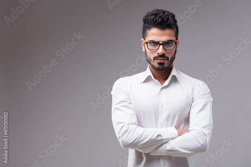 Dark-skinned man, almost aggressive, in glasses © Giulio_Fornasar