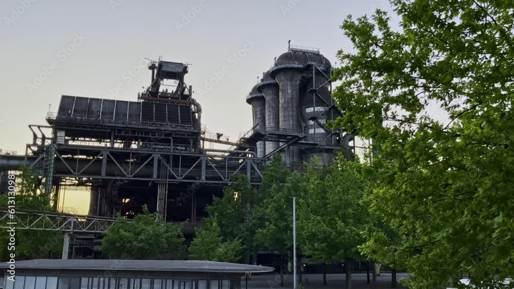 Industrial site in nature in the evening at sunset in the landscape park in duisburg germany Industrial site in nature in the evening at sunset in the landscape park in duisburg germany