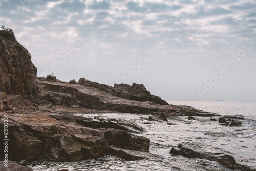 Nature background with cliff of rock, sea and sky