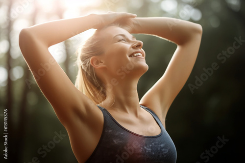 Athletic blonde woman outstretching her arms after doing exercises.