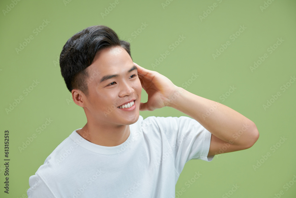 Portrait of a man touching his hair Portrait of a man touching his hair