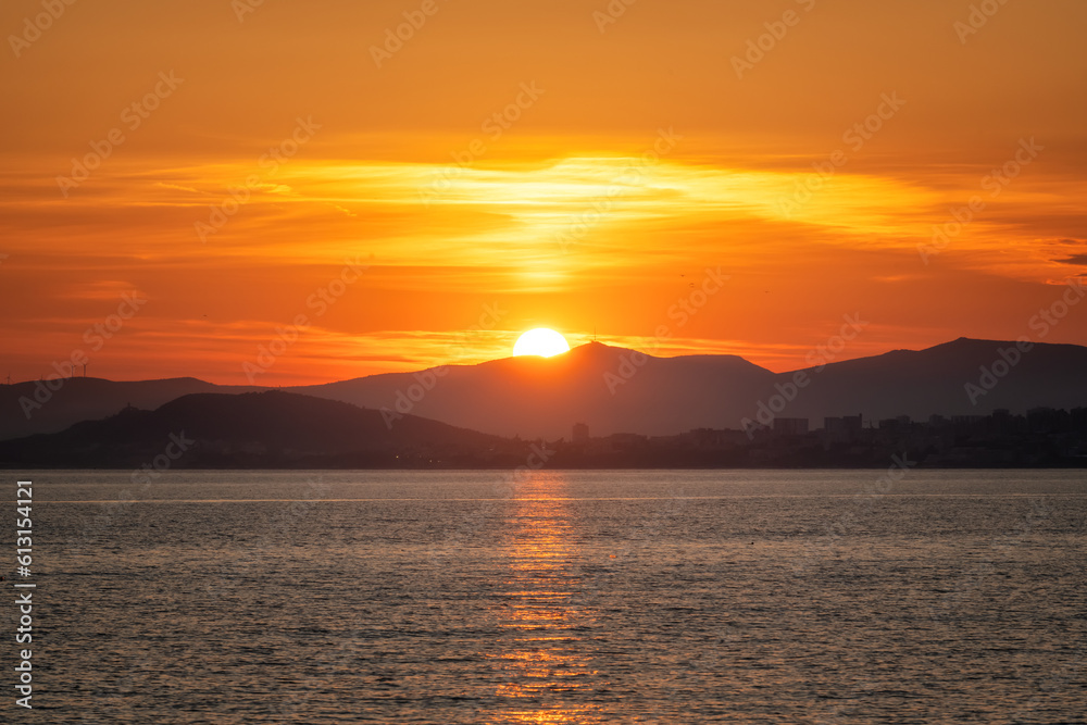Amazing view with colorful sunset sky above the Adriatic sea coastline
